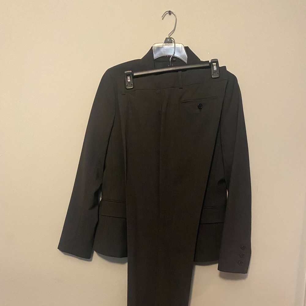 Gray two piece suit well made. Brand new.